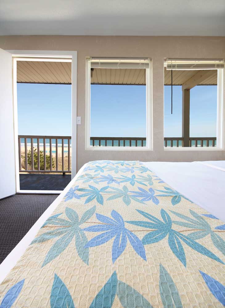 Our oceanfront room has large windows overlooking the beach.