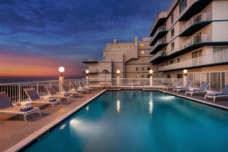 Take in a picture-perfect view of the beach while you relax on our rooftop pool.