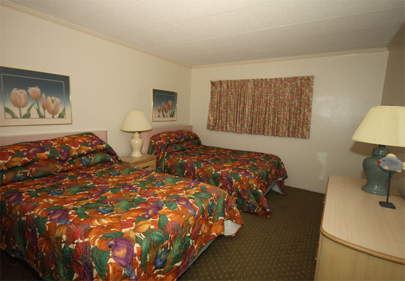 A bedroom with two queen beds.
