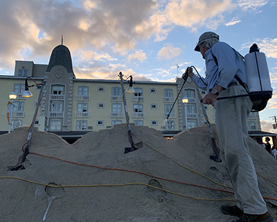 left photo Randy Hofman finishing sand scultpure